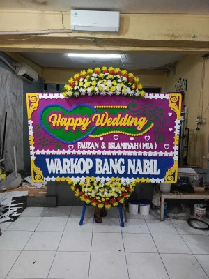 Papan Bunga di Tanah Baru Beji